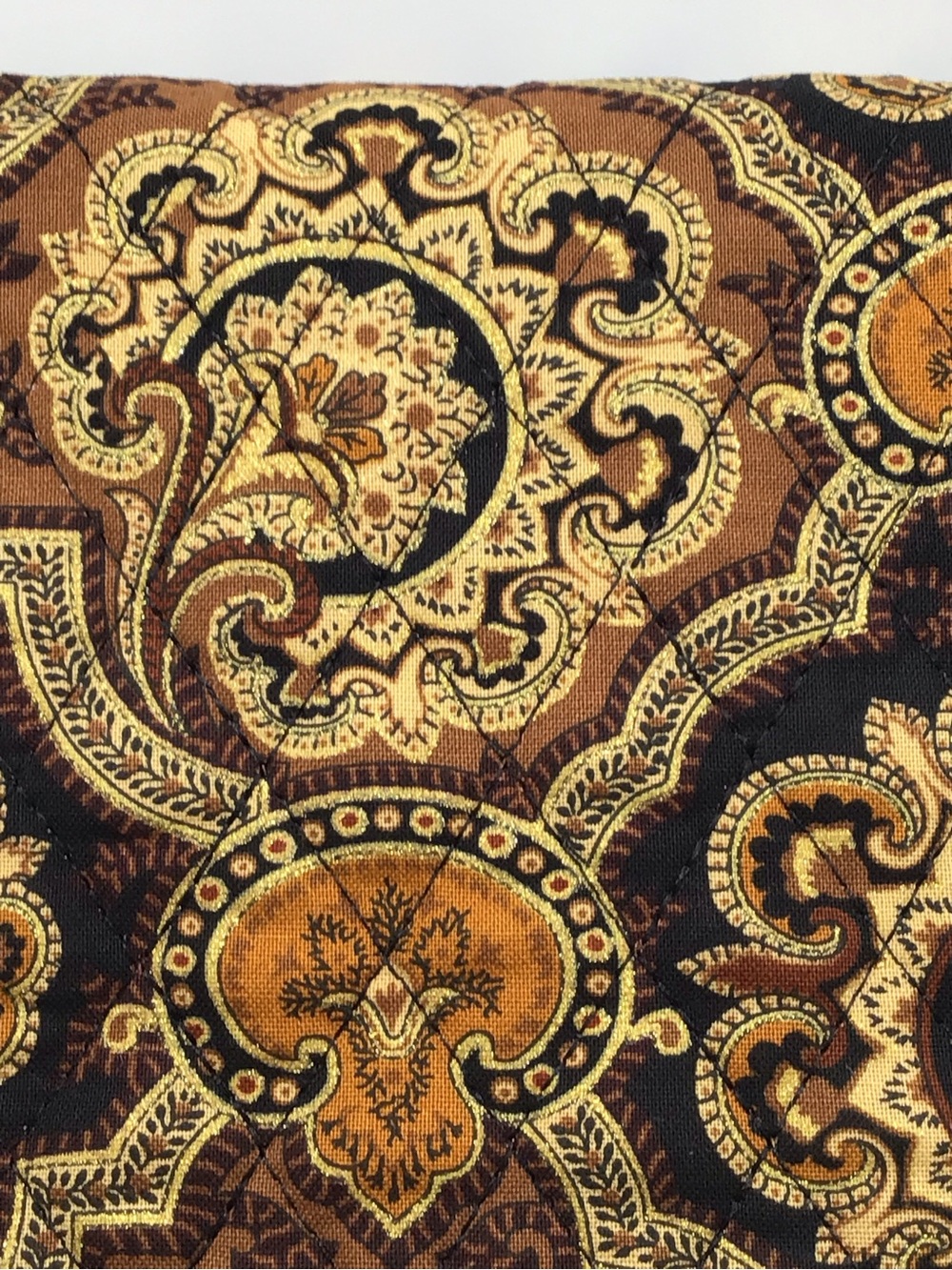 Paisley Medallion 2sided quilted fabric gold is metallic and size is 2.5ydx18in